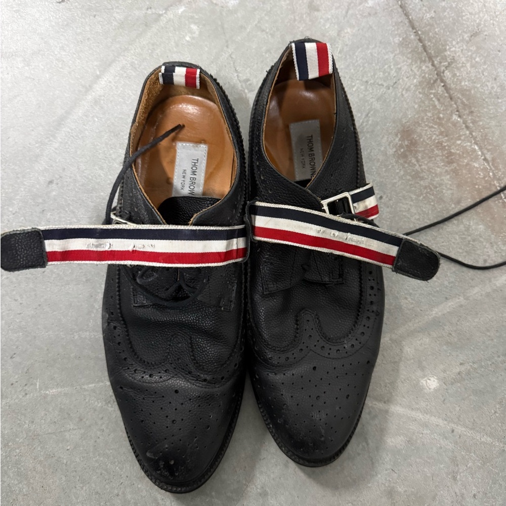 Thom Browne Black Leather Wingtip Oxfords with Red, White & Blue Straps
